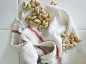 Raw cashews on a dishtowel