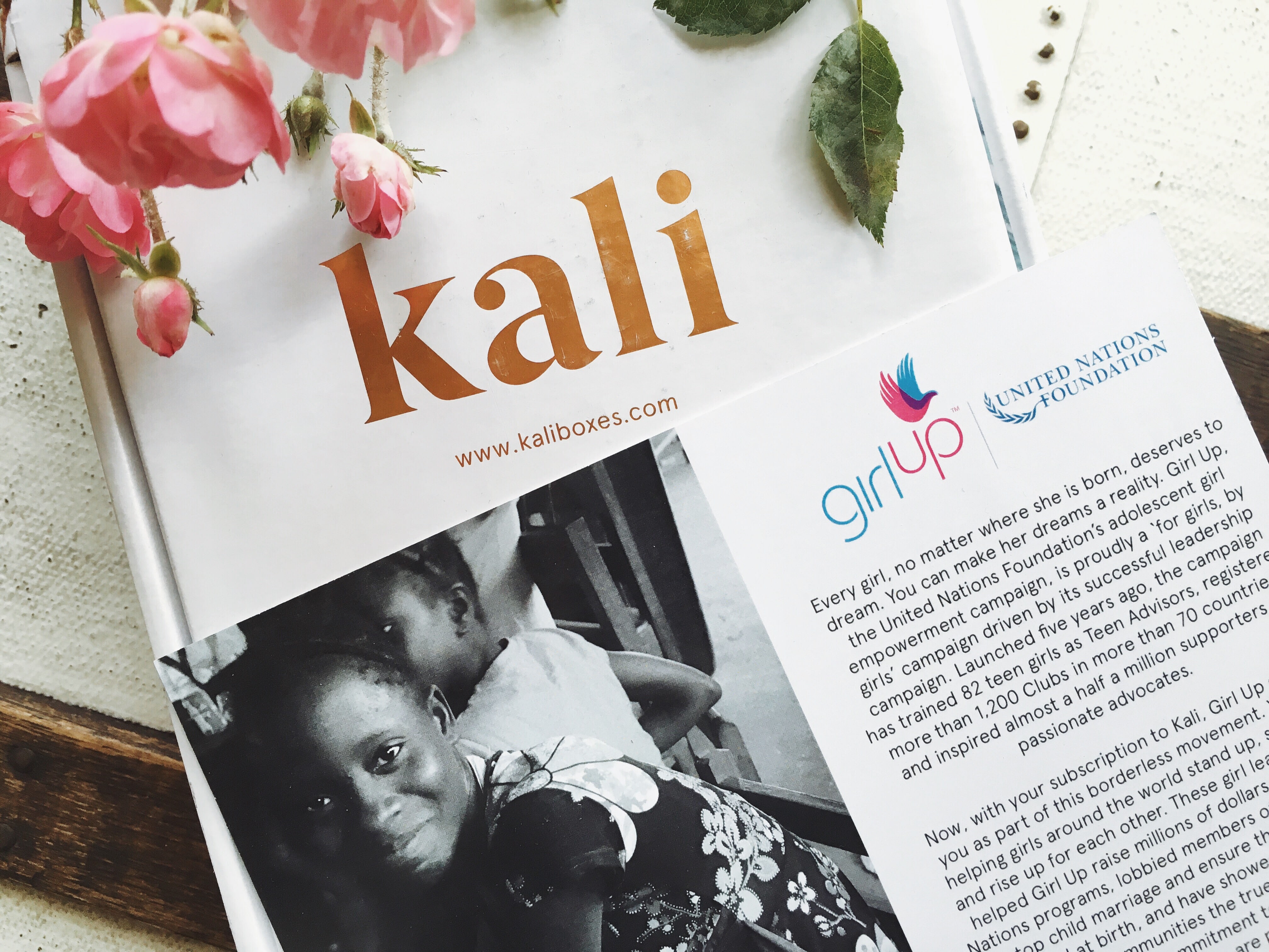 Kali subscription box with Girl Up brochure 