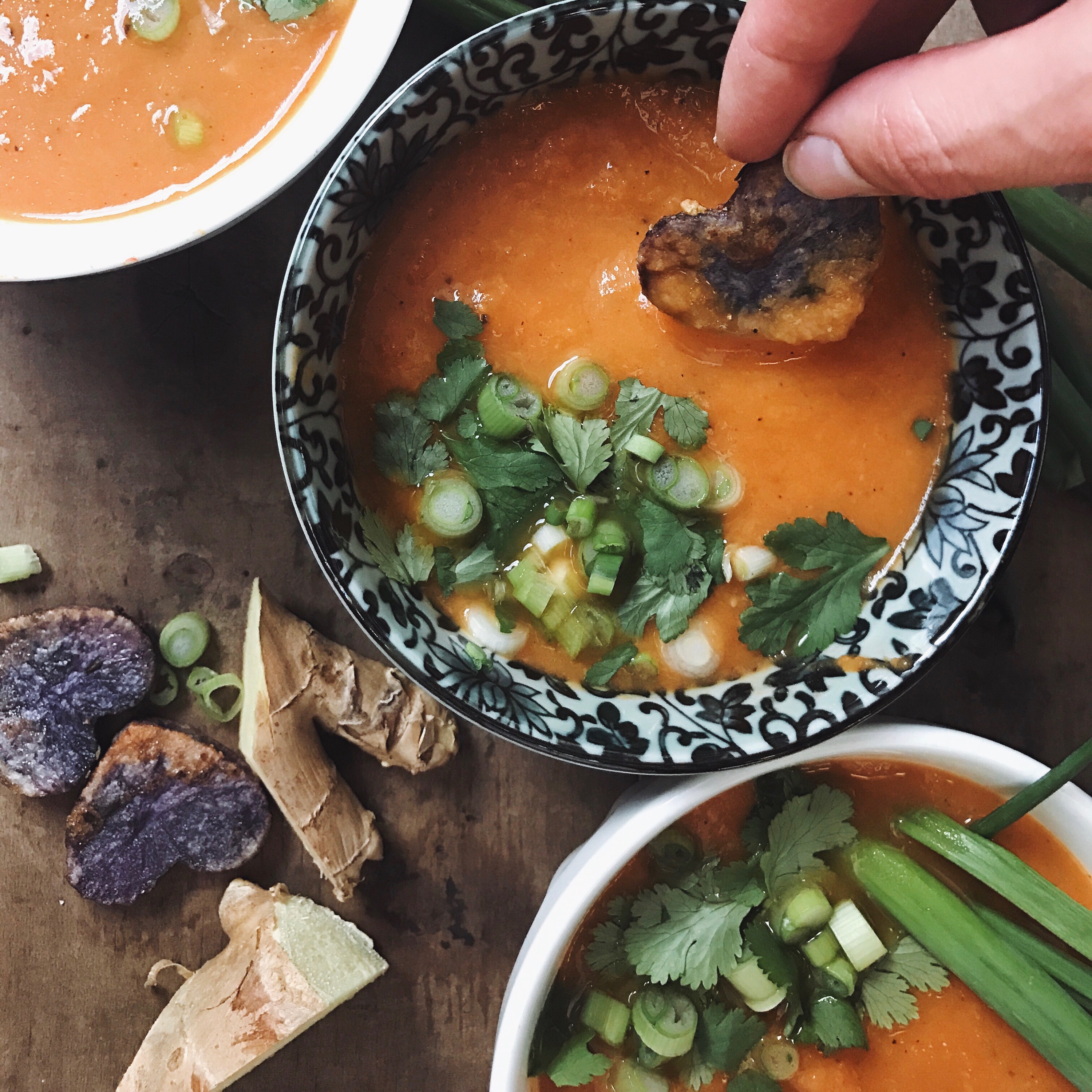 Carrot ginger jalapeno soup with purple potato hearts